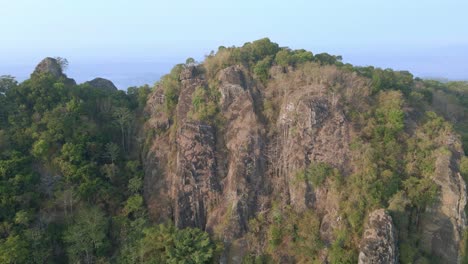 Aerial-pan-shot-of-Pre-historic-volcano-of-Nglanggeran-in-Wonosari-Yogyakarta,-Indonesia