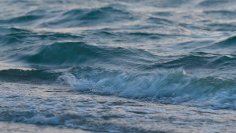 A-close-up-view-of-wavelets-hitting-the-beach-for-tranquility-and-relaxation
