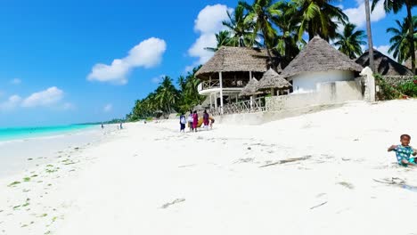 African-children-playing-on-the-sand-of-Jambiani-beach,-Zanzibar