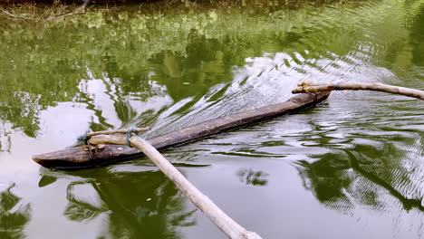 Closeup-shot-of-oars-of-traditional-fishing-boat-at-Saleri-river-Goa-India-4K