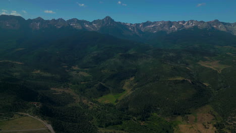 Colorado-scenic-aerial-cinematic-drone-summer-San-Juans-Rocky-Mountains-Ridgway-Ralph-Lauren-Ranch-Mount-Sniffels-Dallas-Range-14er-Million-Dollar-Highway-morning-blue-sky-circle-right-movement