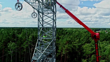 Drone-images-show-the-enormous-height-at-which-workers-are-installing-a-high-voltage-pylon
