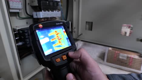 Technician-Use-Thermoscan-Checking-the-Heat-of-Main-Supply-Box,-Close-Up