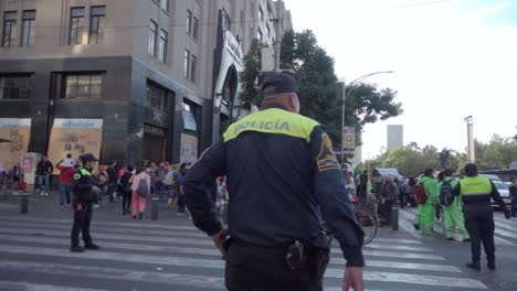 Slow-motion-following-shot-of-Mexican-Police-officers-walking-through-the-streets