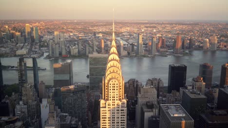 Aerial-view-of-the-New-York-skyline,-empire-state-building,-during-sunset-in-the-summer-time