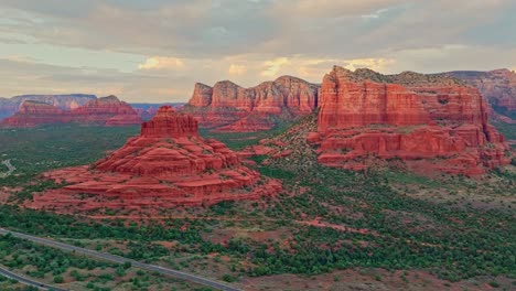 Cinematic-aerial-pullback-reveals-sweeping-round-desert-butte-and-sandstone-in-Sedona-Arizona