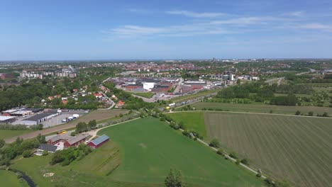 A-Perspective-from-Above-Lund,-Skane,-with-Tetra-Pak-as-its-Center-in-Sweden---Drone-Flying-Forward