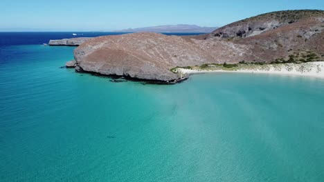 Aerial-panorama-view-of-Balandra-Beach-from-a-distance-with-blue-waters-and-white-sand-in-Baja-California-Sur,-La-Paz,-Mexico