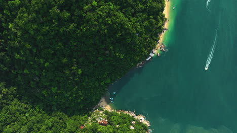 Aerial-view-above-the-Colomitos-Beach-and-jungles-of-sunny-Puerto-Vallarta,-Mexico