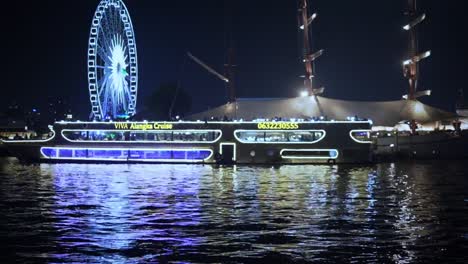 Un-Timelapse-De-Vista-Nocturna-De-La-Noria-Y-Asiatique-La-Orilla-Del-Río-Chao-Phraya-En-Bangkok