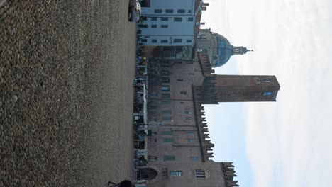 Tower-and-vault-behind-an-ancient-square-in-Mantua,-Italy