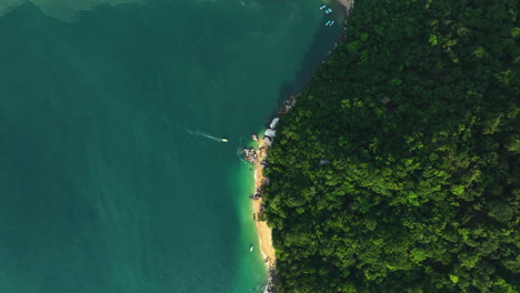 Aerial-top-down-shot-above-the-Colomitos-Beach-and-rainforests-of-sunny-Puerto-Vallarta,-Mexico