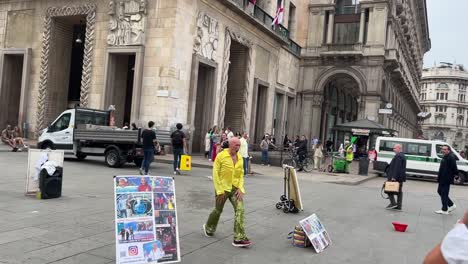 cinematic-video-of-a-street-hustler-and-dancer-dancing-in-the-streets-of-Milan-near-the-Duomo-trying-to-make-money-and-spreading-happy-and-good-vibes