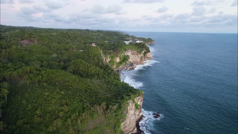 Yogyakarta-Sea-Cliffs-on-Bali-Island-Coastline,-Establishing-Aerial-Drone-Shot