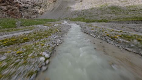 Flying-low-over-rough-and-rugged-terrain-of-Fellaria-glacier-in-Valmalenco,-Valtellina-in-Italy