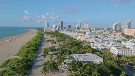 Drone-view-of-Miami-South-Beach-with-blue-sky-coastline-and-high-rise-buildings