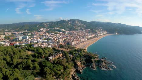 Aerial-images-of-Fanals-beach-on-the-Costa-Brava-Lloret-De-Mar,-Mediterranean-beach,-English-tourism-in-Spain