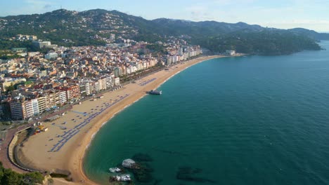 Panoramic-view-of-Lloret-De-Mar-beach,-Costa-Brava,-Girona-images-with-Drone