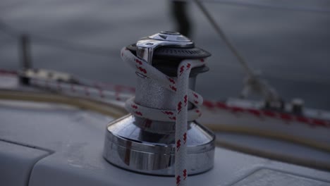 This-stock-video-footage-features-a-close-up-detail-shot-of-a-winch-on-a-sailboat