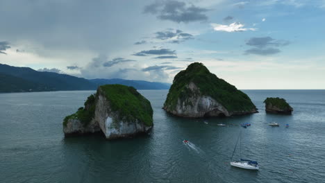 Drone-shot-flying-low-over-the-Mismaloya-arches,-evening-in-Puerto-Vallarta,-Mexico
