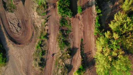 Aerial-Top-View-Of-Motocross-Racing-Track-Between-Trees
