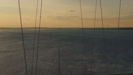 Sunset's-canvas:-Aerial-view-of-Humber-Bridge-with-cars-creating-a-tranquil-panorama