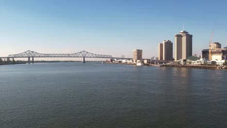 A-beautiful-view-of-the-Mississippi-River,-the-Crescent-City-Connection-bridge,-and-New-Orleans