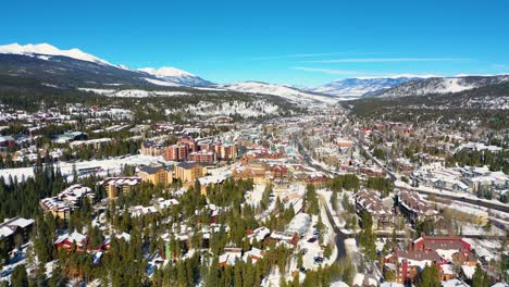 Aerial-Drone-View-of-Snowy-Breckenridge-Colorado-Rocky-Mountain-Town-with-Vacation-Homes,-Resorts-and-Hotels-for-Travel-in-Winter-Ski-Weather