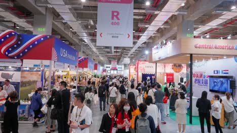 Crowds-of-people-walking-around-food-booth-stand-featuring-Japan-and-USA