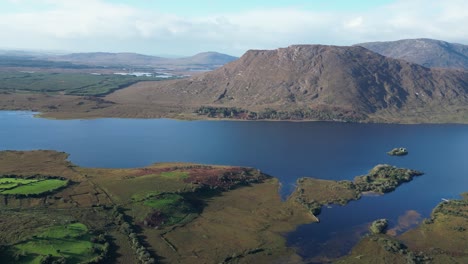 Aerial-drone-footage-and-panorama-view-of-the-mountains-and-waters-of-Connemara-Loop,-Galway-County,-Ireland