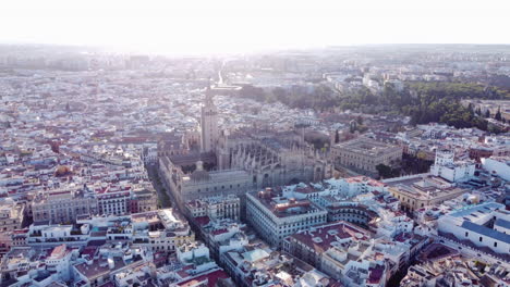 Aerial-View-Of-Seville-Cathedral-On-Foggy-Morning-In-Seville,-Spain