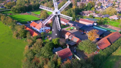 High-above,-video-footage-showcases-the-iconic-Waltham-Windmill-and-Rural-History-Museum-in-Lincolnshire,-UK