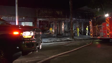 Firefighters-Spray-Water-on-Burned-Building