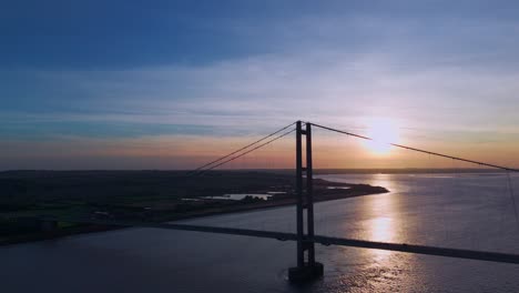 Sunset's-charm:-Aerial-view-of-Humber-Bridge-with-cars-in-motion