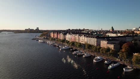 Lake-Mälaren-waterfront-in-Stockholm,-Sweden,-4K-drone-shot