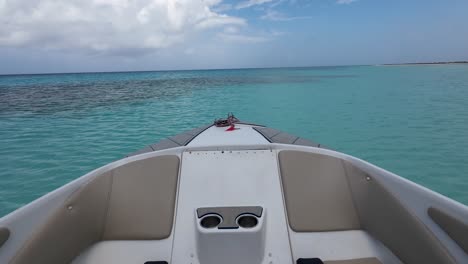 Watch-sea-from-inside-luxury-boat-floating-on-blue-caribbean-sea,-tilt-up