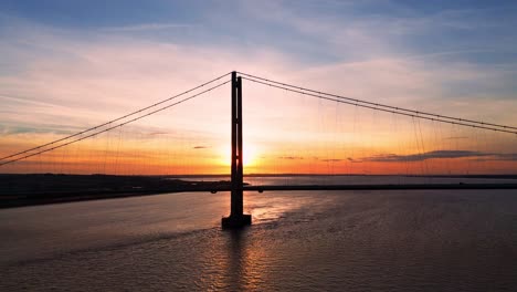 A-symphony-of-light-and-movement:-Humber-Bridge-at-sunset-with-cars