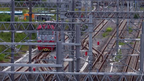 View-from-the-top-of-the-front-car-of-a-train,-operated-by-the-State-Railway,-as-it-moves-from-Bang-Sue-Central-Station-in-Bangkok,-Thailand