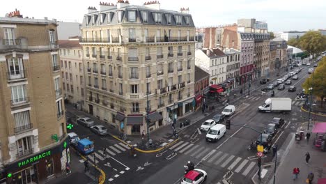 Panoramic-Aerial-View-of-Vintage-Paris-City-Street-Old-Buildings-and-Pedestrians-in-Hoche-Pantin-Station-during-Autumn-Daylight,-Establishing-Shot
