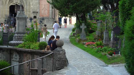 Couple-with-Their-Dog-Rests-in-the-Shade-near-St