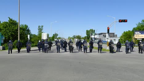 Riot-police-on-the-highway-during-the-G7-summit-in-Charlevoix,-Quebec,-Canada