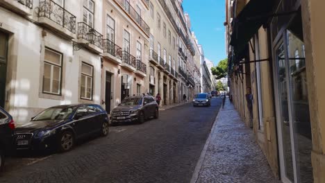 Local-people-going-about-their-business-in-cars-and-on-foot,-Lisbon,-Portugal