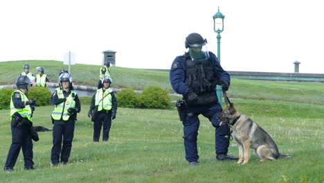 A-K9-police-officer-standing-with-his-partner-on-duty