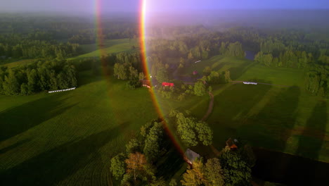 Aerial-drone-view-of-an-amazing-double-rainbow-in-a-countryside-landscape