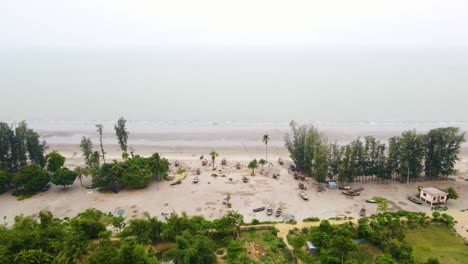 Tilt-down-shot-of-fishing-village-at-kuakata-beach,-Bangladesh