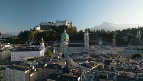 Establishing-Drone-Shot-Above-Salzburg,-Austria-Old-Town-with-Castle-in-Background