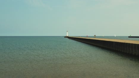 Drone-push-in-shot-shot-of-the-light-houses-at-Sodus-point-New-York-vacation-spot-at-the-tip-of-land-on-the-banks-of-Lake-Ontario