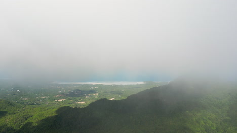 High-altitude-aerial-Shot-of-Highlands-of-Party-Island-Koh-phangan-with-fog-stream