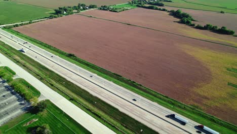 Following-three-semi-trucks-and-trailers-on-highway-I-90-Illinois