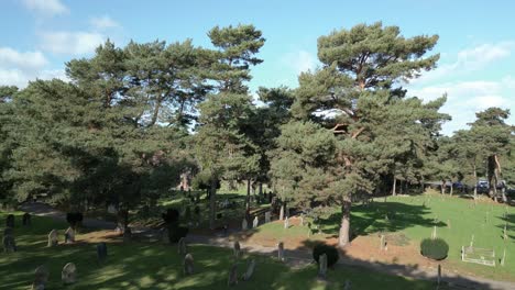 Historic-Headstone-Over-Green-Yard-In-Wymondham-Cemetery,-Wymondham,-Norfolk,-England,-UK